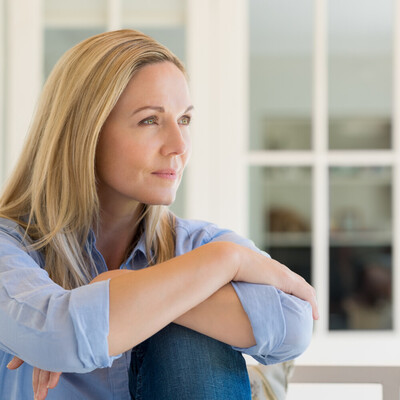 Woman in quiet reflection supported by emotional wellbeing hypnotherapy in Canada